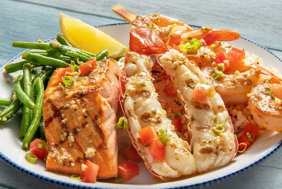 Main lobster tail, jumbo shrimp skewer and fresh Atlantic salmon finished with a brown butter sauce from Red Lobster.
